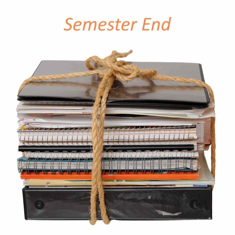 Stack of notebooks and binders with words ‘semester end’ written above it.