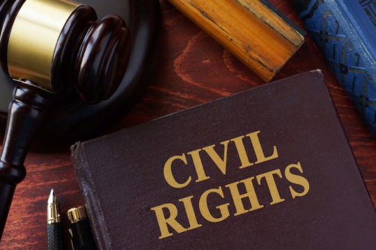 Civil Rights book on a table next to a gavel