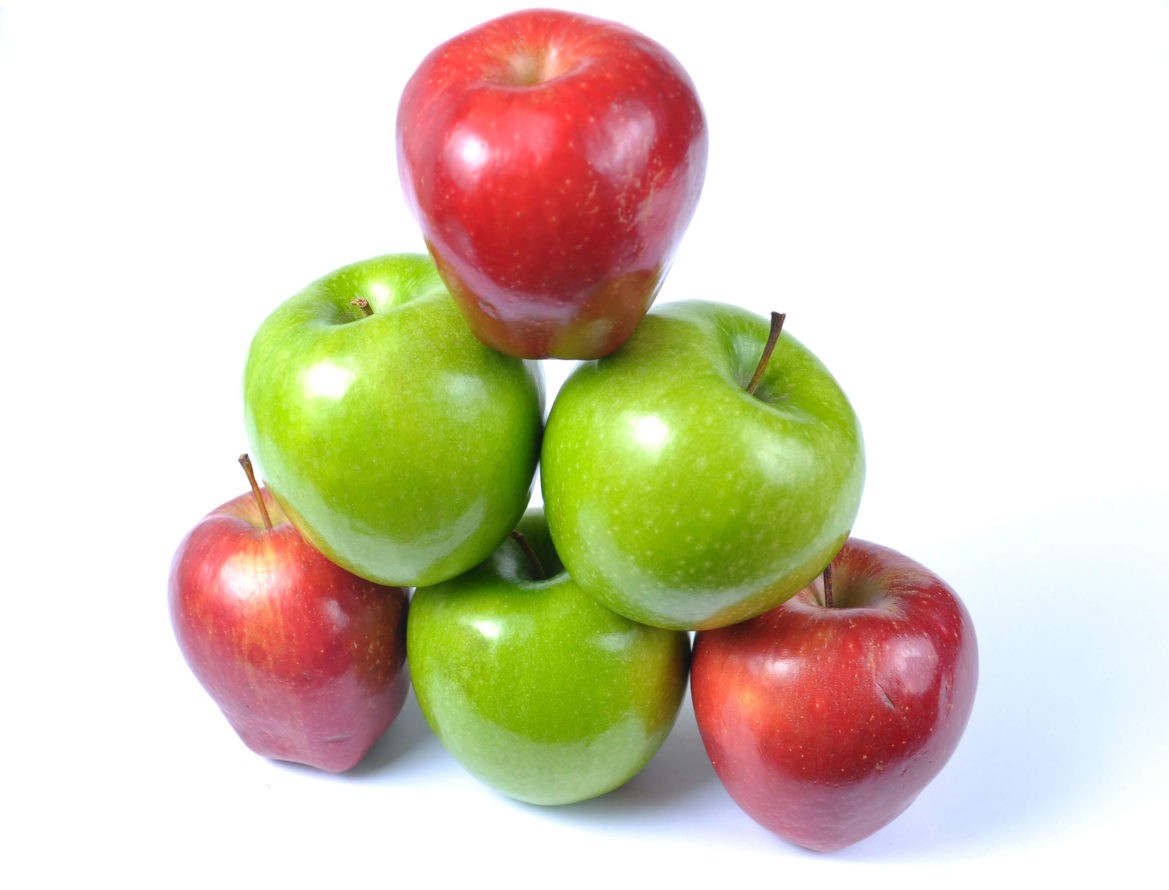 A stack of red and green apples formed into a pyramid