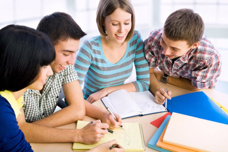 Group of students working together at a table.